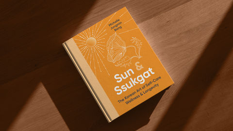 Bright orange illustrated cover for Sun & Ssukgat